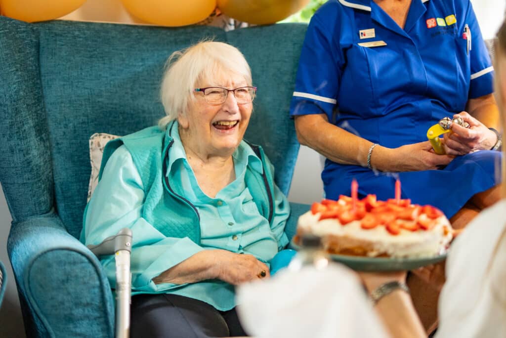 Residents and staff at Appleby Grange celebrating a birthday